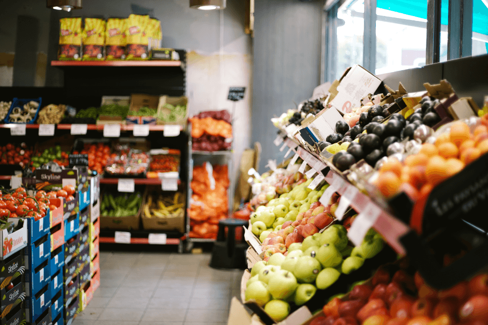Open air Produce shop with racks and racks of fruits and vegetables